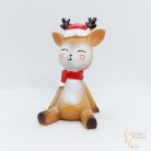 Piros sapkás ülő szarvas